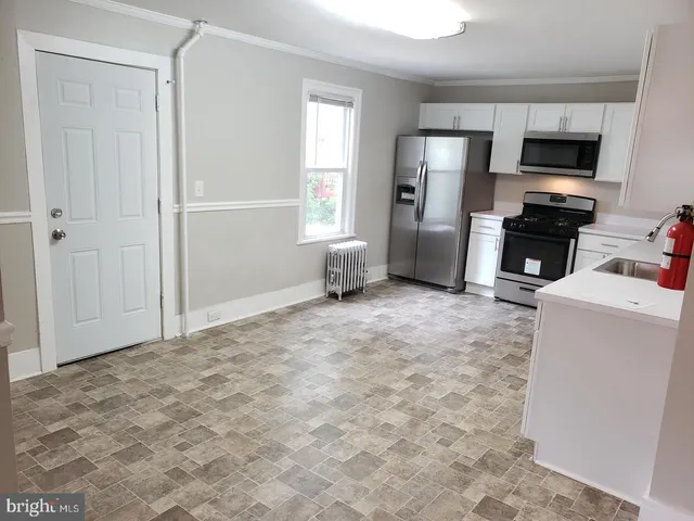 a view of a livingroom with furniture and a flat screen tv