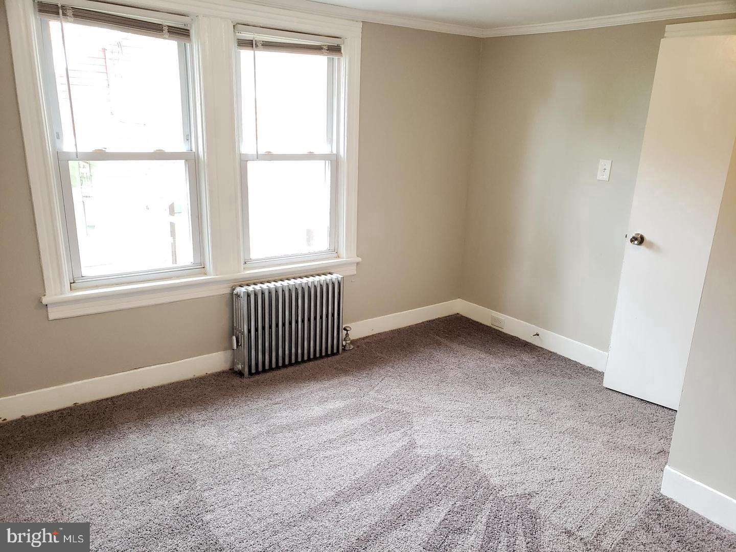 3 North Summit Avenue, Unit 3A Pitman, NJ 08071 - Photo 17 of 22 an empty room with windows