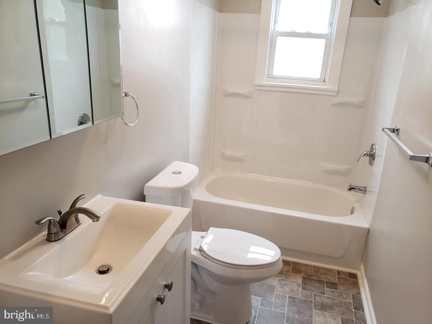 3 North Summit Avenue, Unit 3A Pitman, NJ 08071 - Photo 20 of 22 a bathroom with a sink a toilet and bathtub