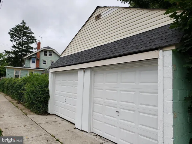 a front view of a house with garage