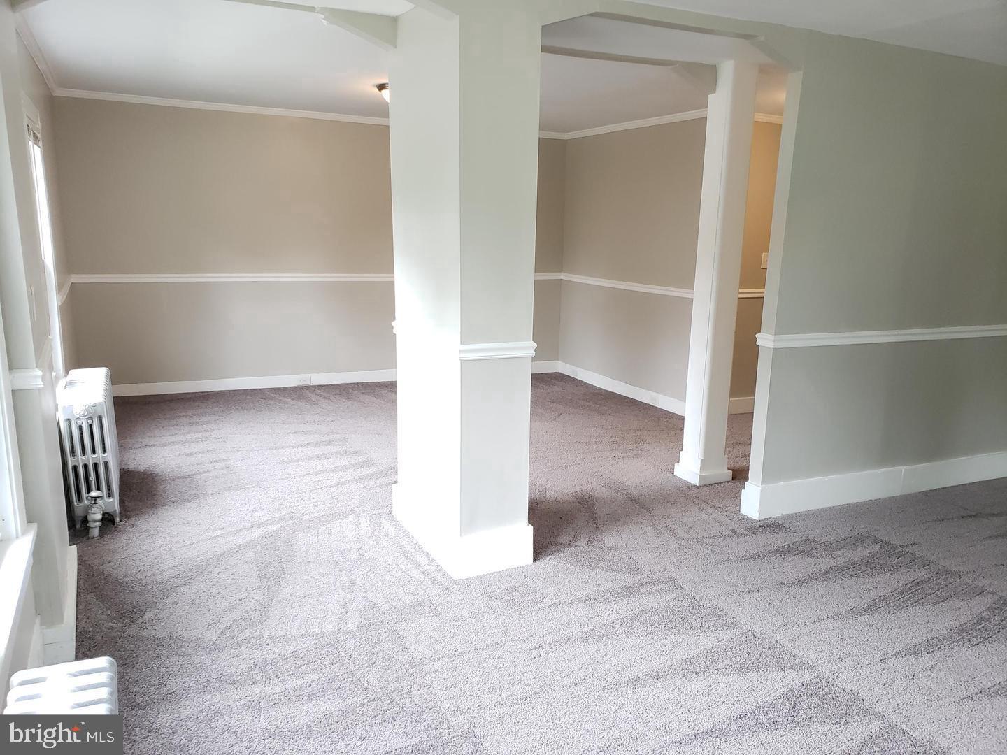 3 North Summit Avenue, Unit 3A Pitman, NJ 08071 - Photo 8 of 22 a view of an empty room with wooden floor and a window