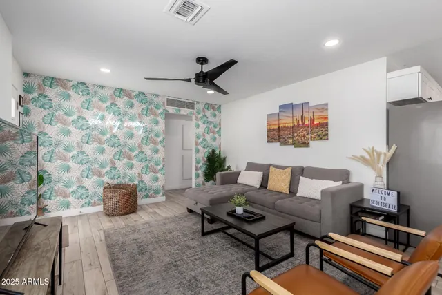 a living room with furniture and a flat screen tv