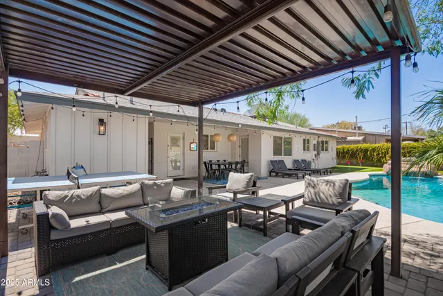 a outdoor space with a table and chairs
