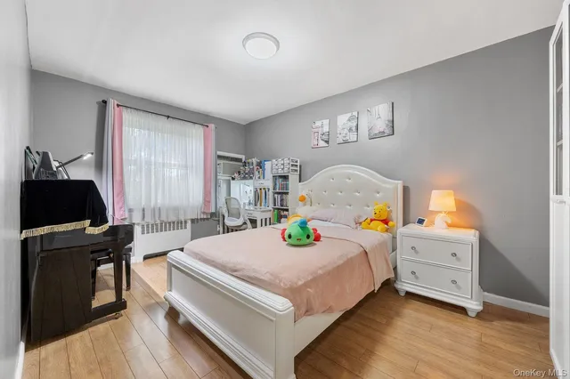 a bedroom with a bed and a desk