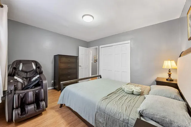 a bedroom with a bed and a closet