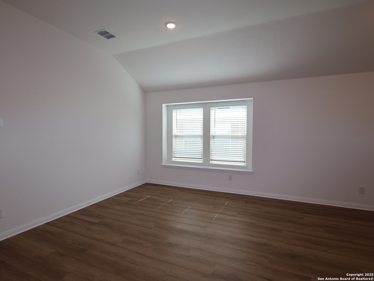 2804 Whiskey Pass Seguin, TX 78155 - Photo 19 of 28 a view of an empty room with wooden floor and a window
