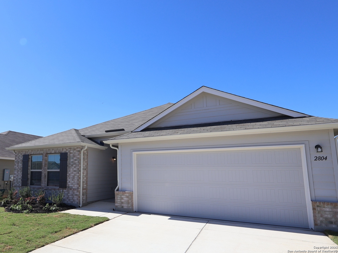 2804 Whiskey Pass Seguin, TX 78155 - Photo 28 of 28 a front view of a house with garden