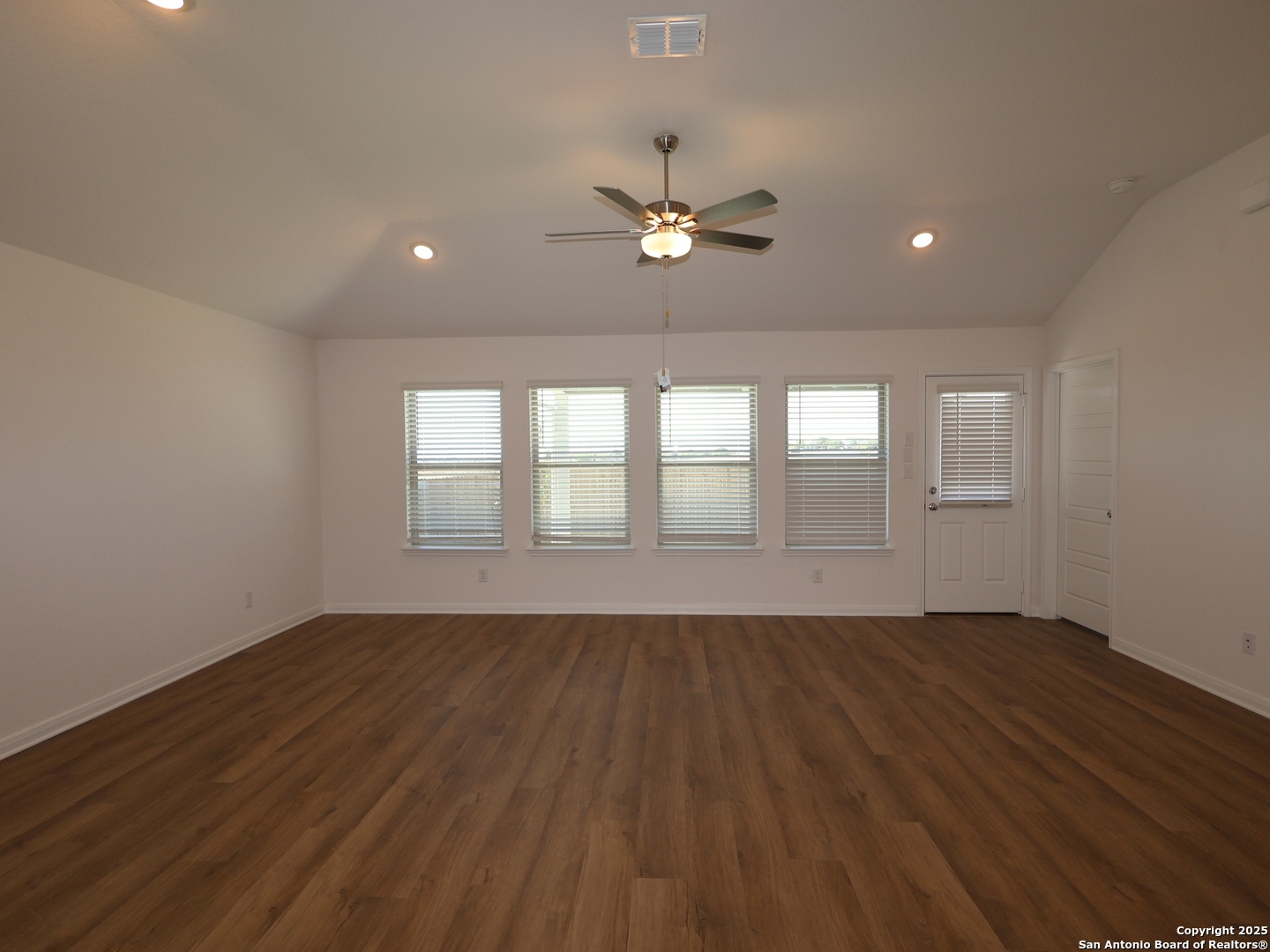 2804 Whiskey Pass Seguin, TX 78155 - Photo 6 of 28 a view of an empty room with wooden floor and a window
