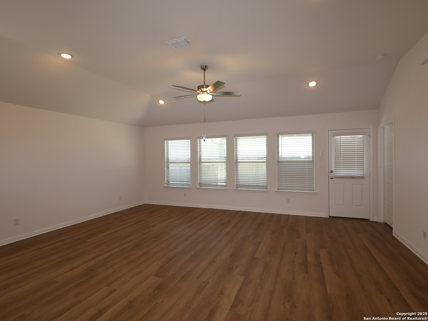 2804 Whiskey Pass Seguin, TX 78155 - Photo 7 of 28 a view of an empty room with wooden floor and a window