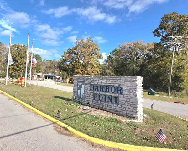 a view of a park with iron fence