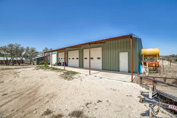 a big house with wooden fence