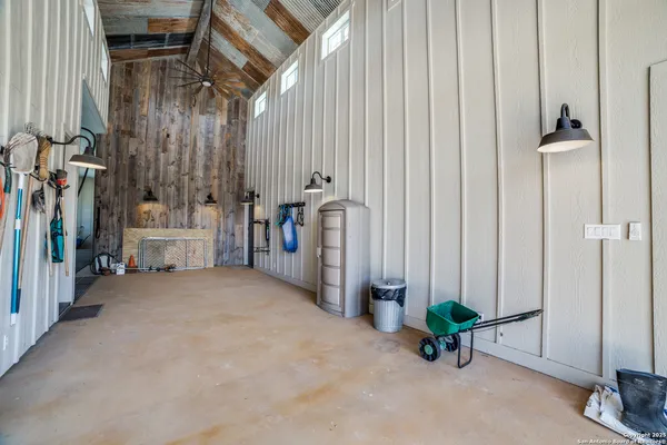 a view of a yard with wooden fence