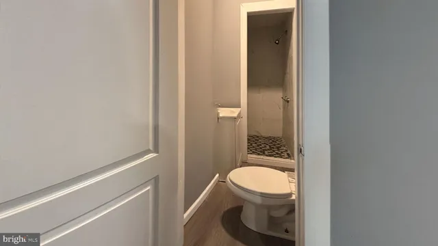 a bathroom with a toilet and a sink