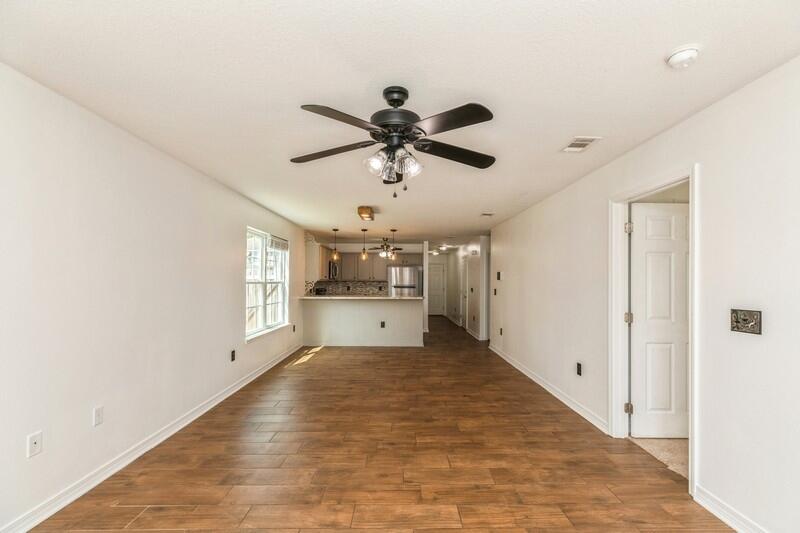 412 Eisenhower Drive Crestview, FL 32539 - Photo 14 of 35 a view of a kitchen with a sink and a window