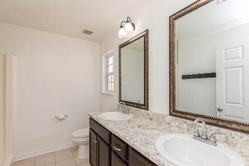 412 Eisenhower Drive Crestview, FL 32539 - Photo 20 of 35 a bathroom with a granite countertop sink toilet and mirror