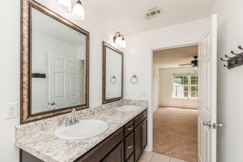 412 Eisenhower Drive Crestview, FL 32539 - Photo 21 of 35 a bathroom with a granite countertop sink and a mirror