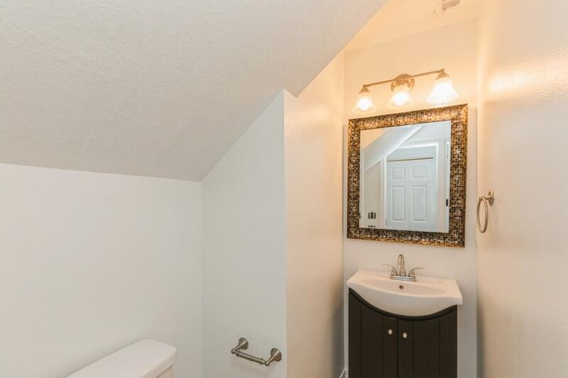 412 Eisenhower Drive Crestview, FL 32539 - Photo 24 of 35 a bathroom with a toilet sink and mirror
