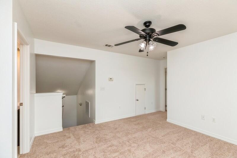 412 Eisenhower Drive Crestview, FL 32539 - Photo 26 of 35 a view of a chandelier fan in a room