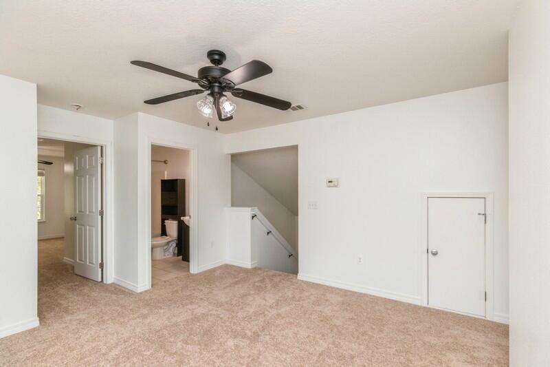 412 Eisenhower Drive Crestview, FL 32539 - Photo 27 of 35 a view of a livingroom with a chandelier fan and a hallway
