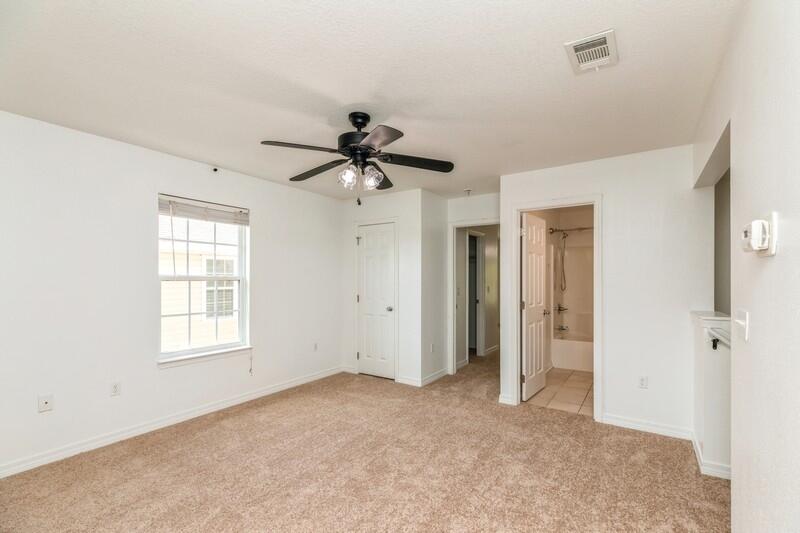 412 Eisenhower Drive Crestview, FL 32539 - Photo 28 of 35 a view of a big room with windows and chandelier fan