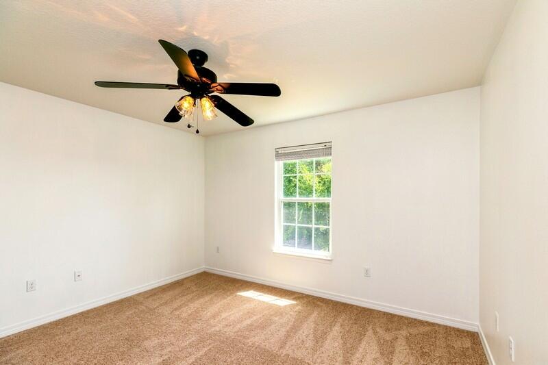 412 Eisenhower Drive Crestview, FL 32539 - Photo 29 of 35 an empty room with a window and a ceiling fan
