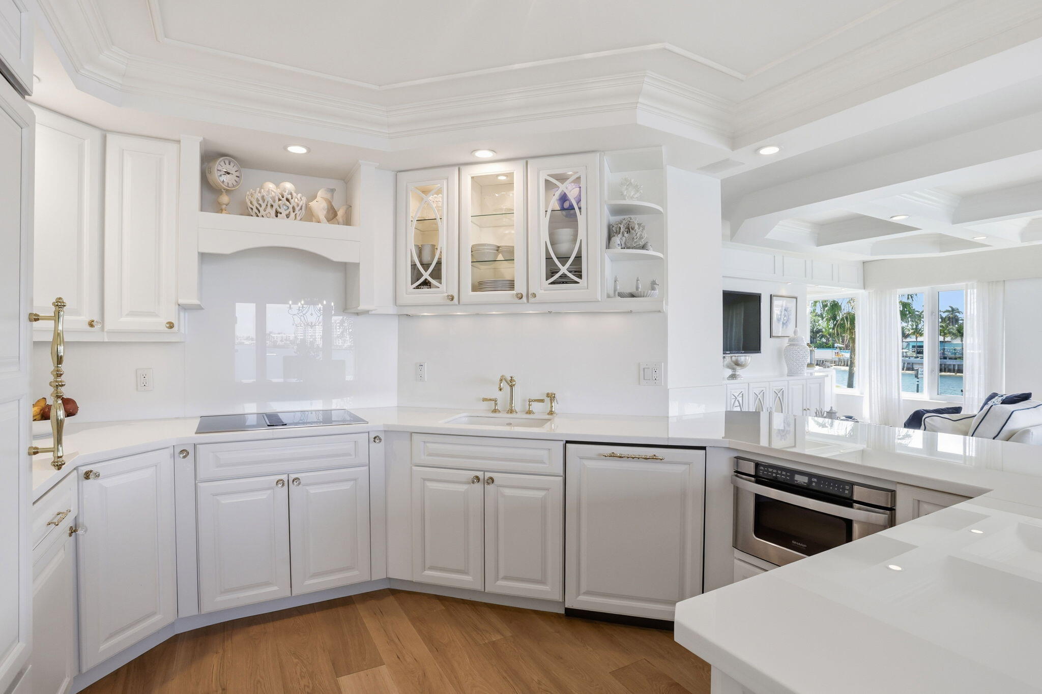 701 East Camino Real, Unit 2J Boca Raton, FL 33432 - Photo 14 of 51 a kitchen with a sink stove and cabinets