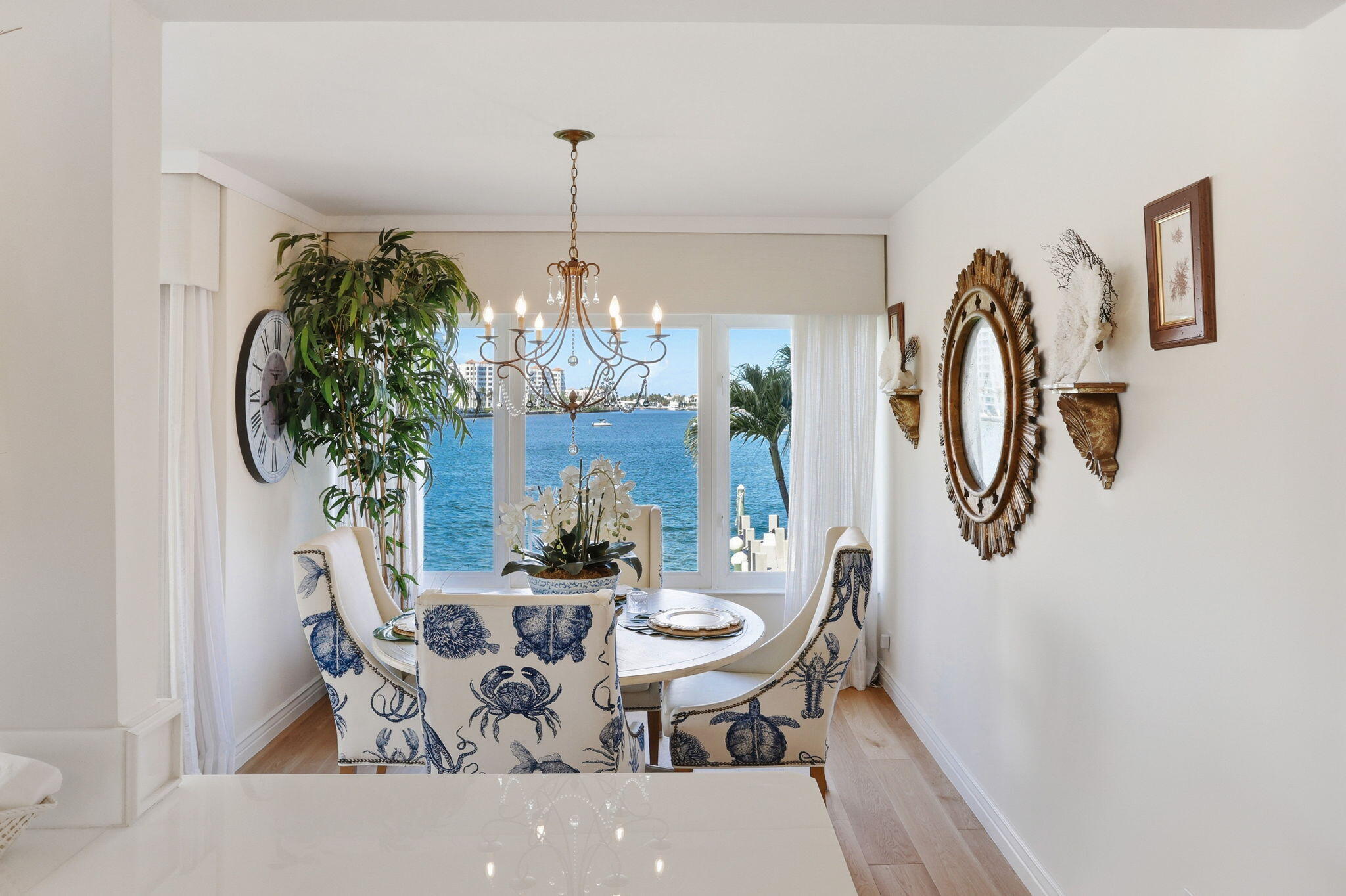 701 East Camino Real, Unit 2J Boca Raton, FL 33432 - Photo 16 of 51 a view of a dining room with furniture and chandelier