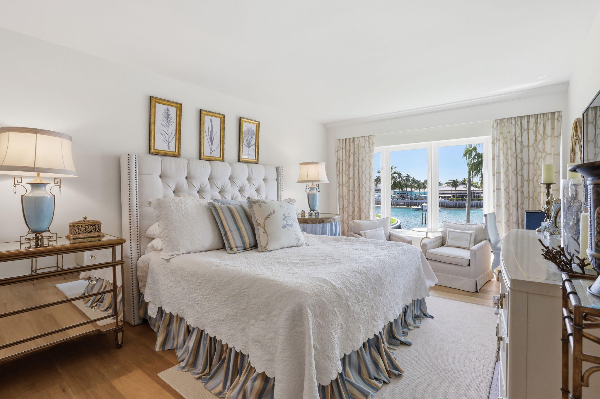 701 East Camino Real, Unit 2J Boca Raton, FL 33432 - Photo 18 of 51 a bedroom with a bed and a night stand