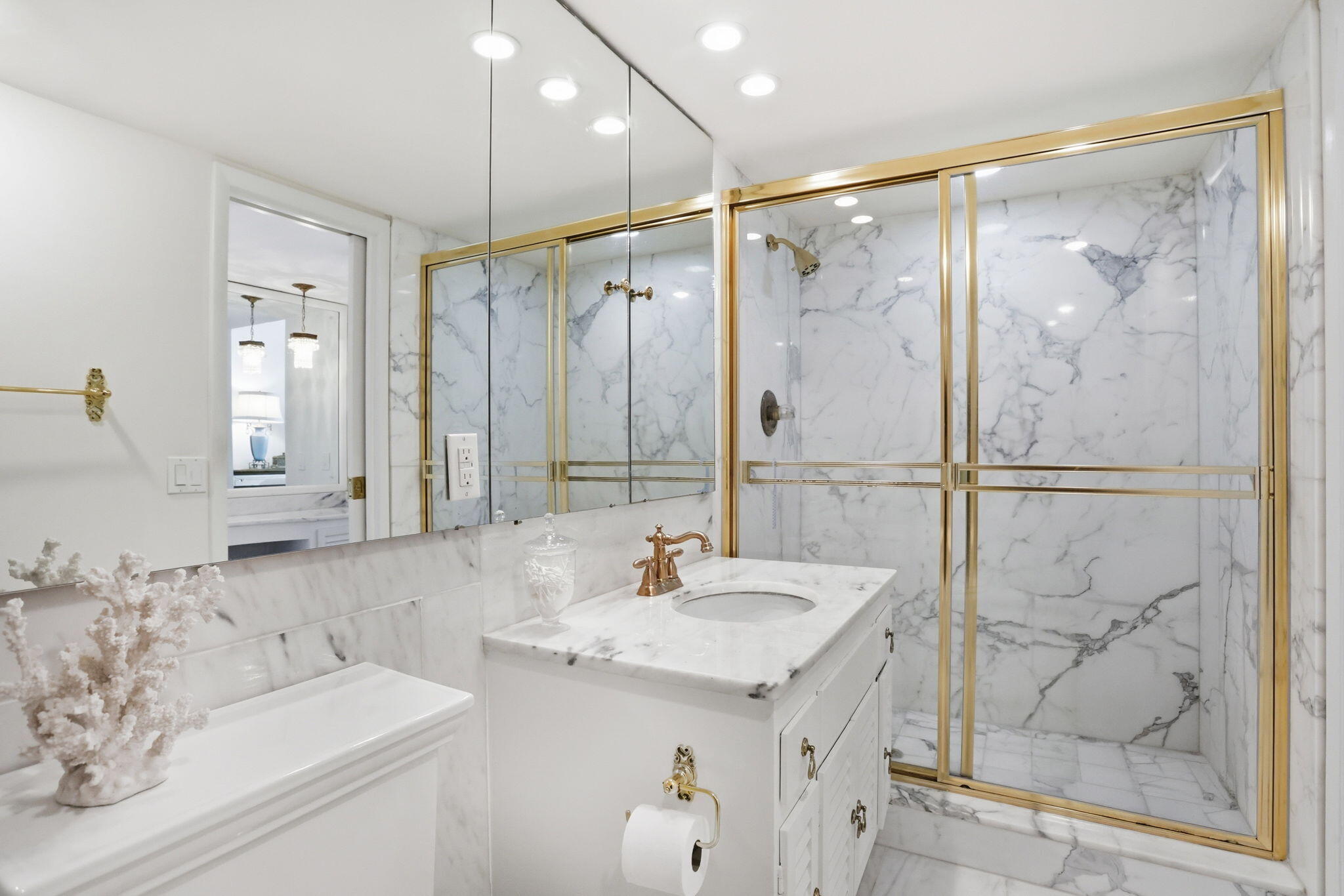 701 East Camino Real, Unit 2J Boca Raton, FL 33432 - Photo 24 of 51 a bathroom with a sink and a mirror