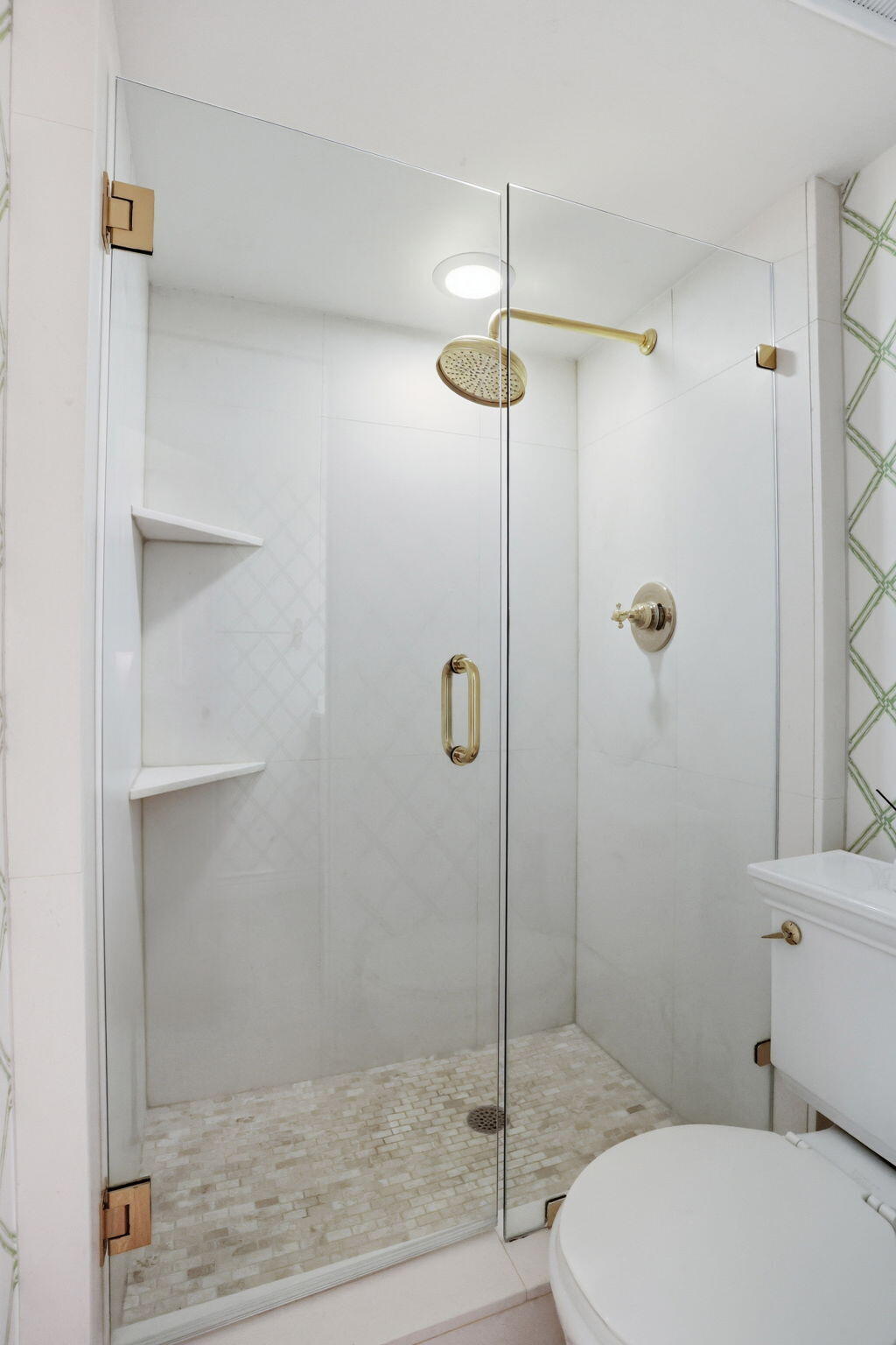 701 East Camino Real, Unit 2J Boca Raton, FL 33432 - Photo 28 of 51 a bathroom with a shower a toilet and a sink
