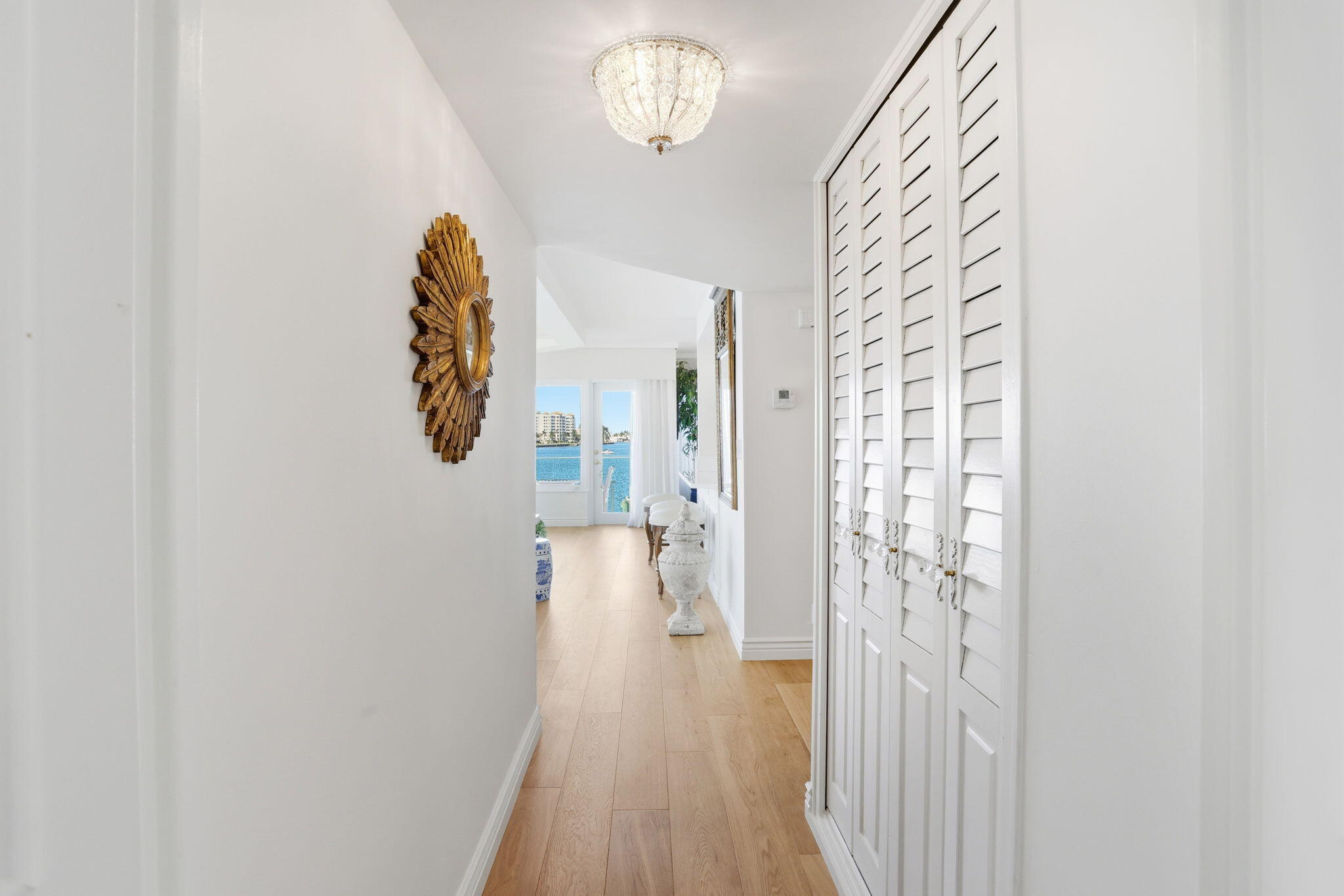 701 East Camino Real, Unit 2J Boca Raton, FL 33432 - Photo 30 of 51 a view of a hallway with wooden floor and staircase
