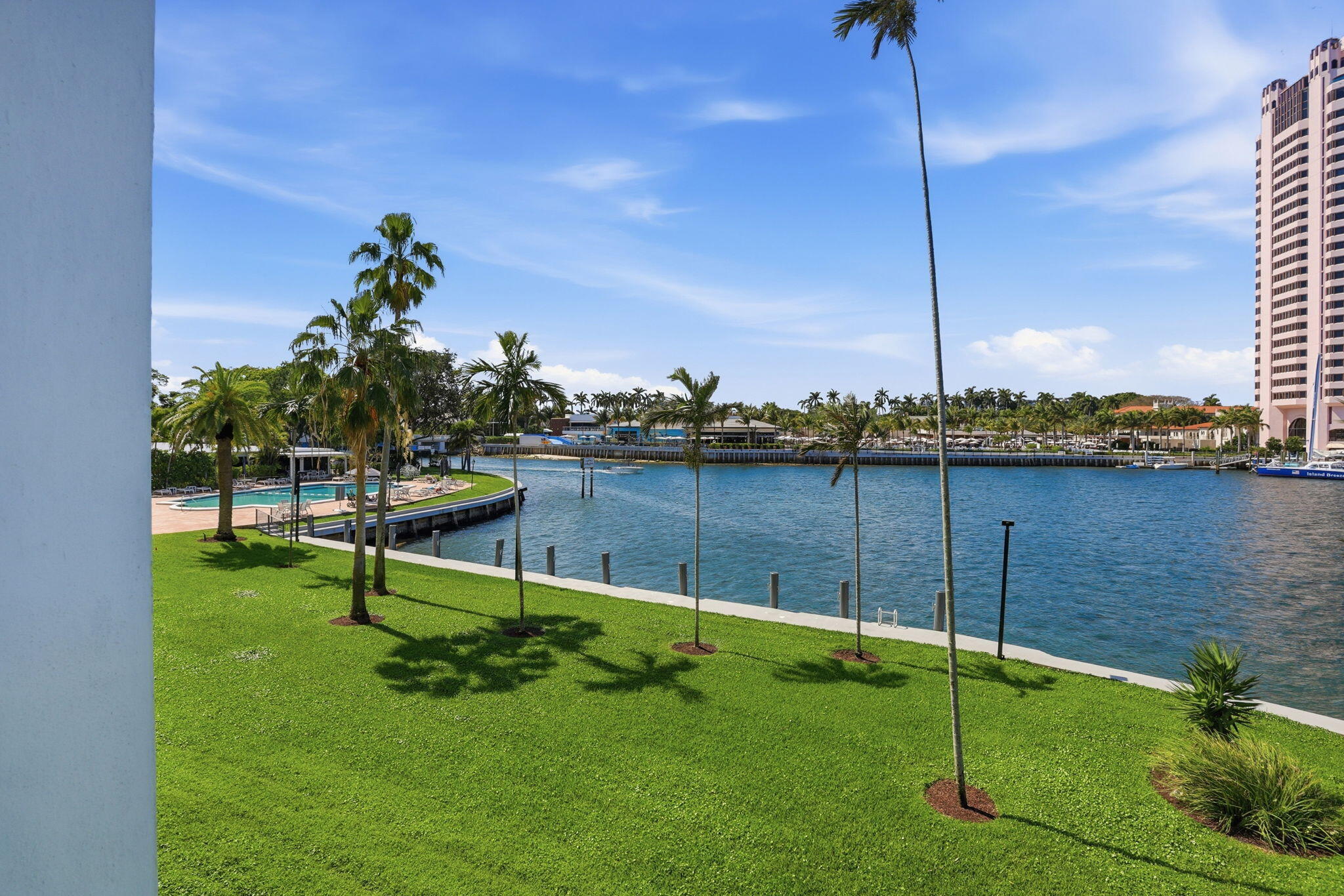 701 East Camino Real, Unit 2J Boca Raton, FL 33432 - Photo 34 of 51 a view of a bench in the garden near a lake