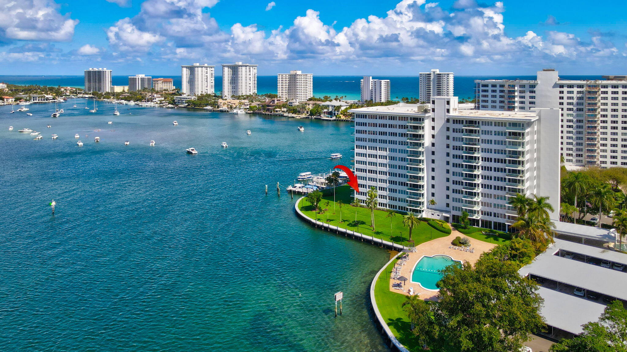 701 East Camino Real, Unit 2J Boca Raton, FL 33432 - Photo 37 of 51 a view of a swimming pool of the patio
