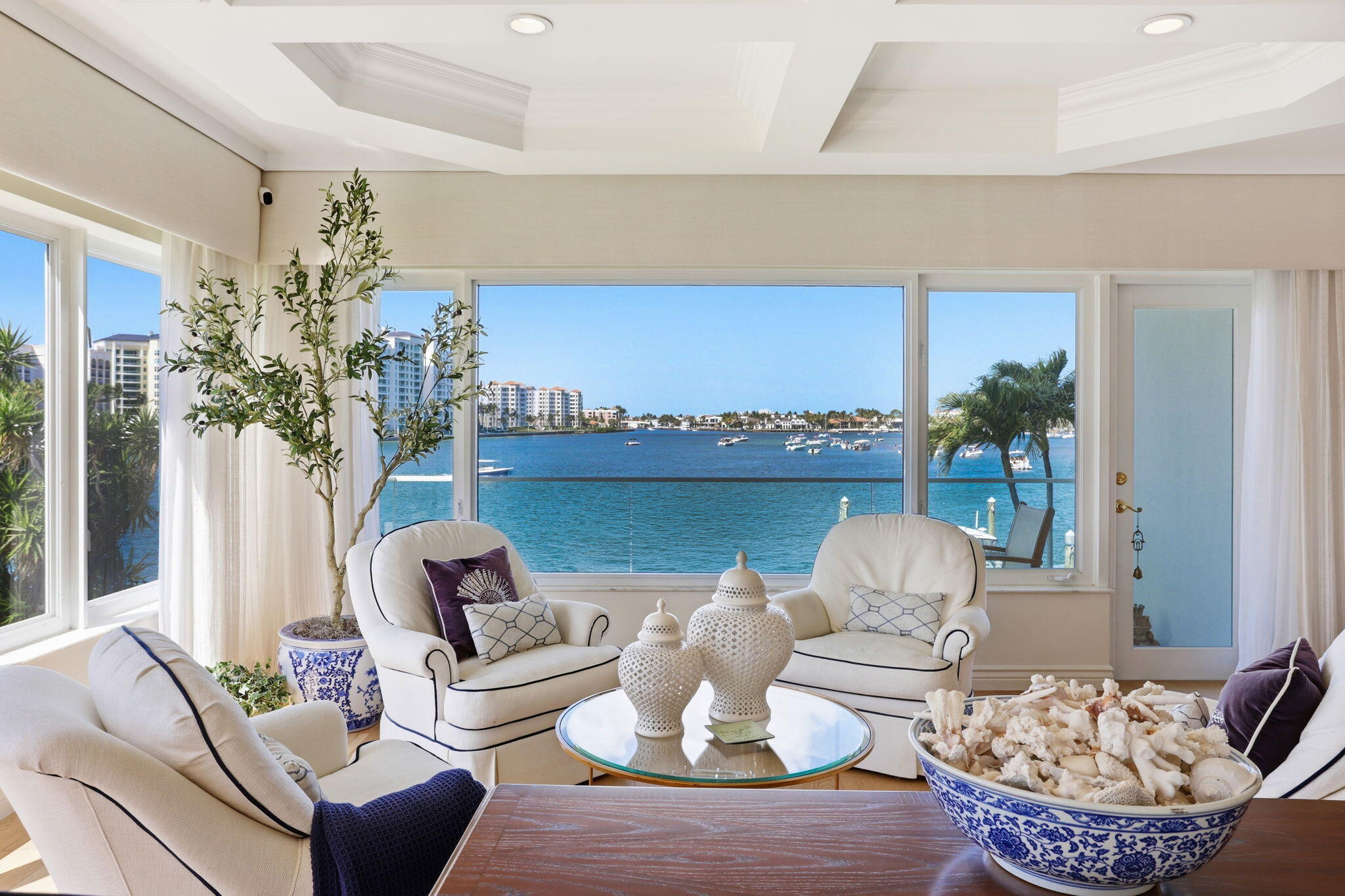 701 East Camino Real, Unit 2J Boca Raton, FL 33432 - Photo 4 of 51 a living room with furniture and a potted plant