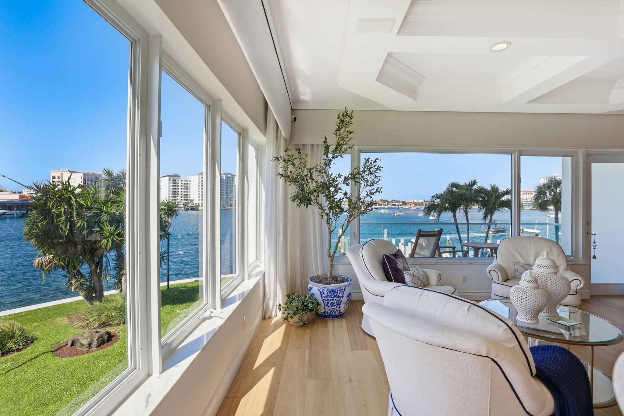 701 East Camino Real, Unit 2J Boca Raton, FL 33432 - Photo 8 of 51 a living room with furniture and a floor to ceiling window