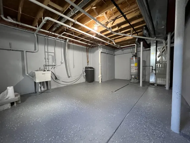 a view of storage and utility room with stairs