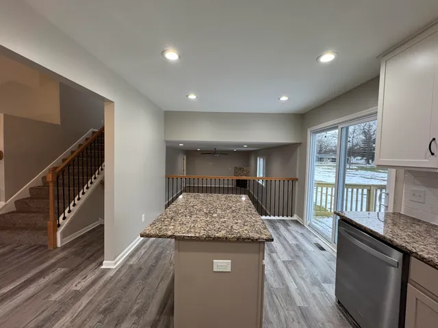 a view of entryway with wooden floor