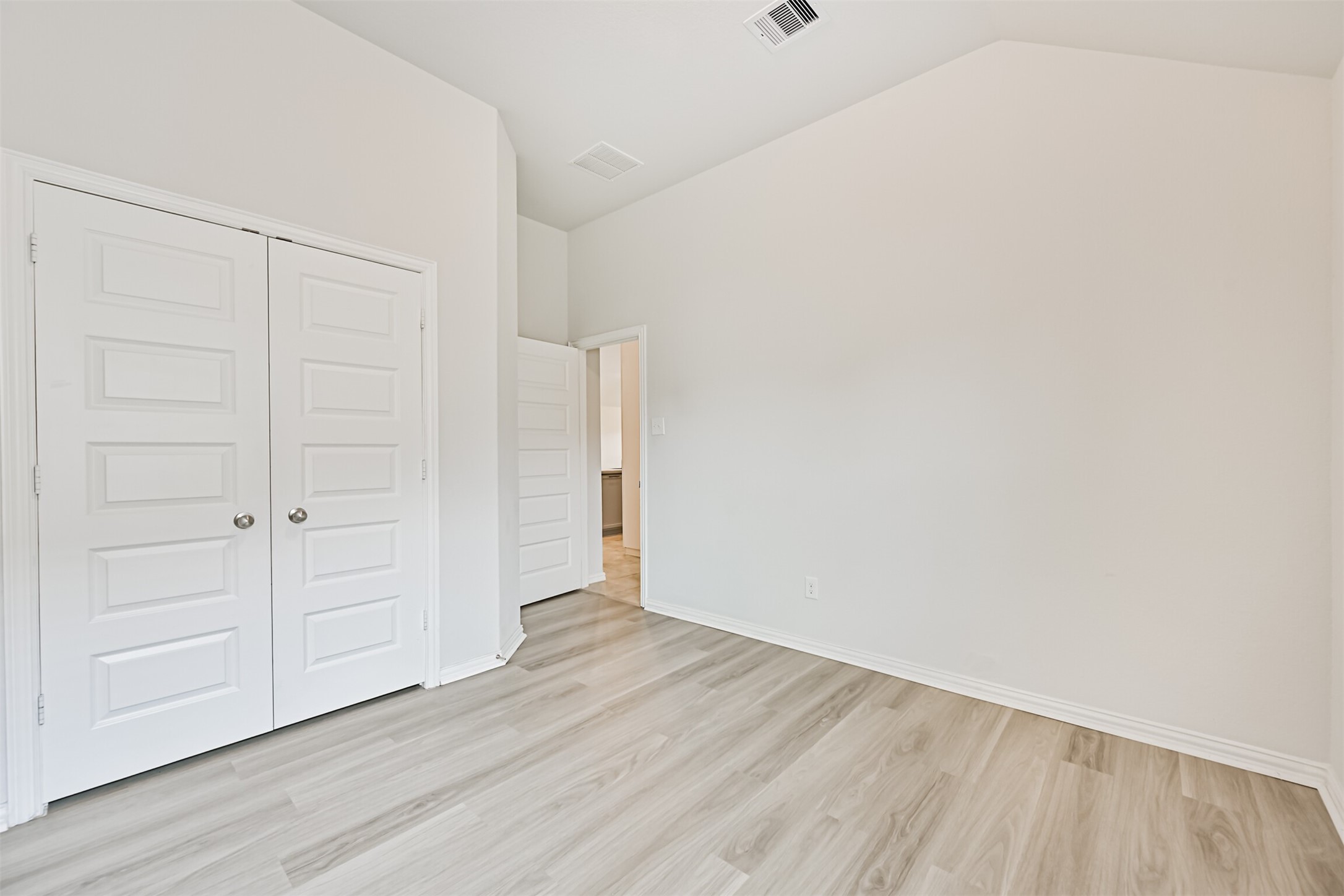 7019 Terra Drive Manvel, TX 77578 - Photo 27 of 41 a view of an empty room and wooden floor