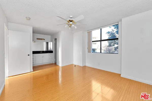 a view of an empty room with a window