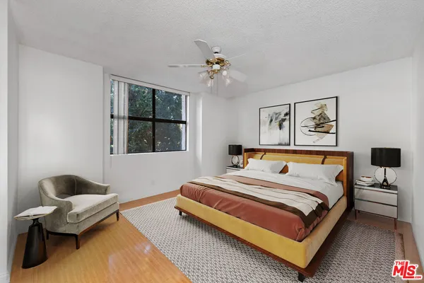 a spacious bedroom with a bed and window