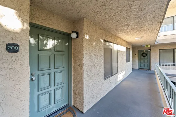 a view of a hallway with windows