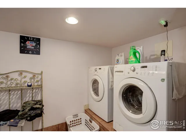 a view of balcony with wooden floor and fence