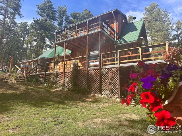 a view of swimming pool with an outdoor seating