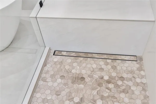 a kitchen with white cabinets and appliances