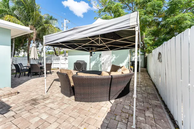 a view of backyard with sitting area