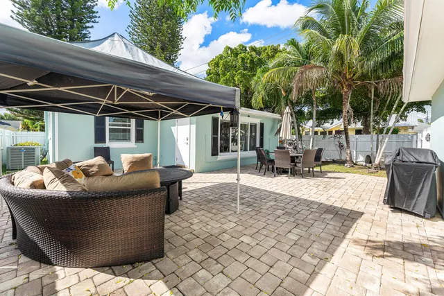 a living room with couch and trees