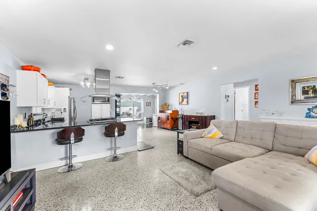 a living room with furniture and a couch