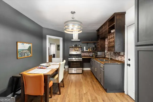 a large kitchen with a table and chairs