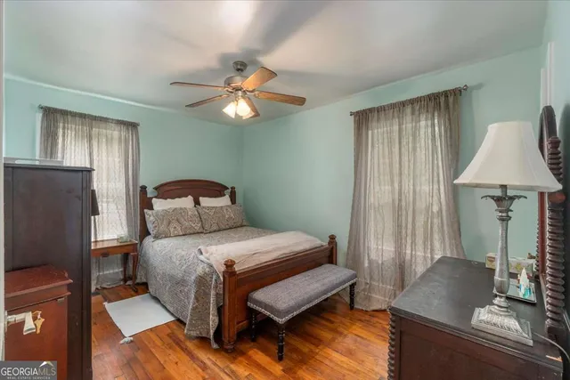 a bedroom with a bed furniture and a window