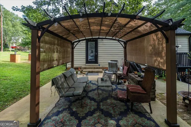 a backyard of a house with barbeque oven